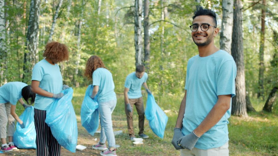 A group of volunteers cleaning up litter in a park